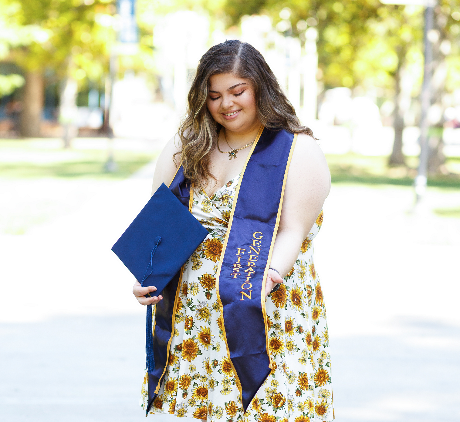 First-generation student, Roseanne Gorelik, standing proudly with her first-gen stole.