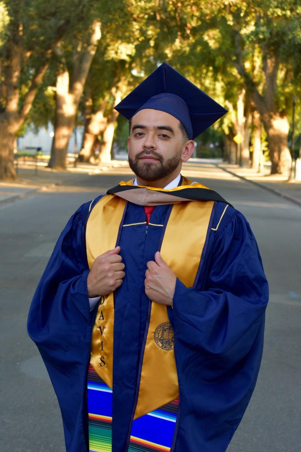 Victor in cap and gown