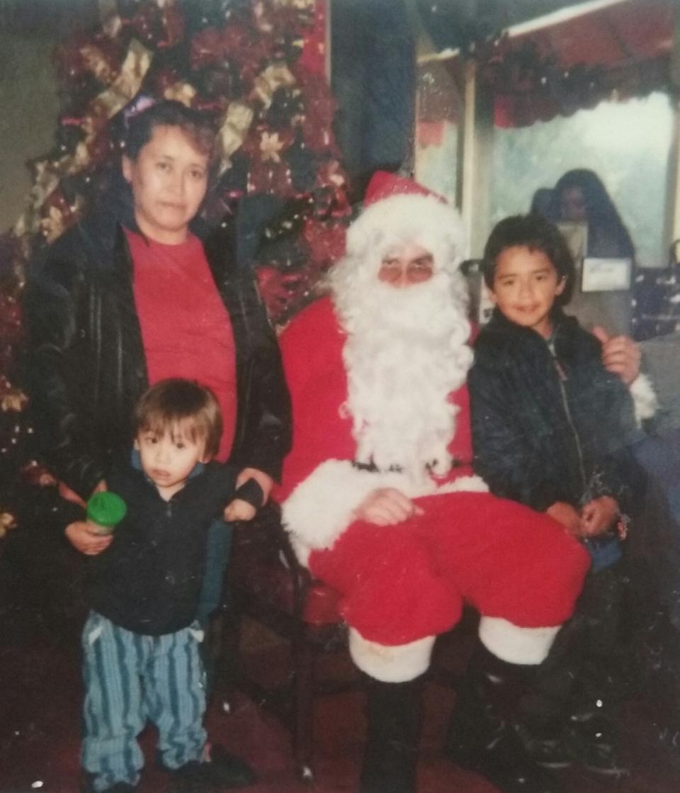 Victor at 8 years old next to Santa