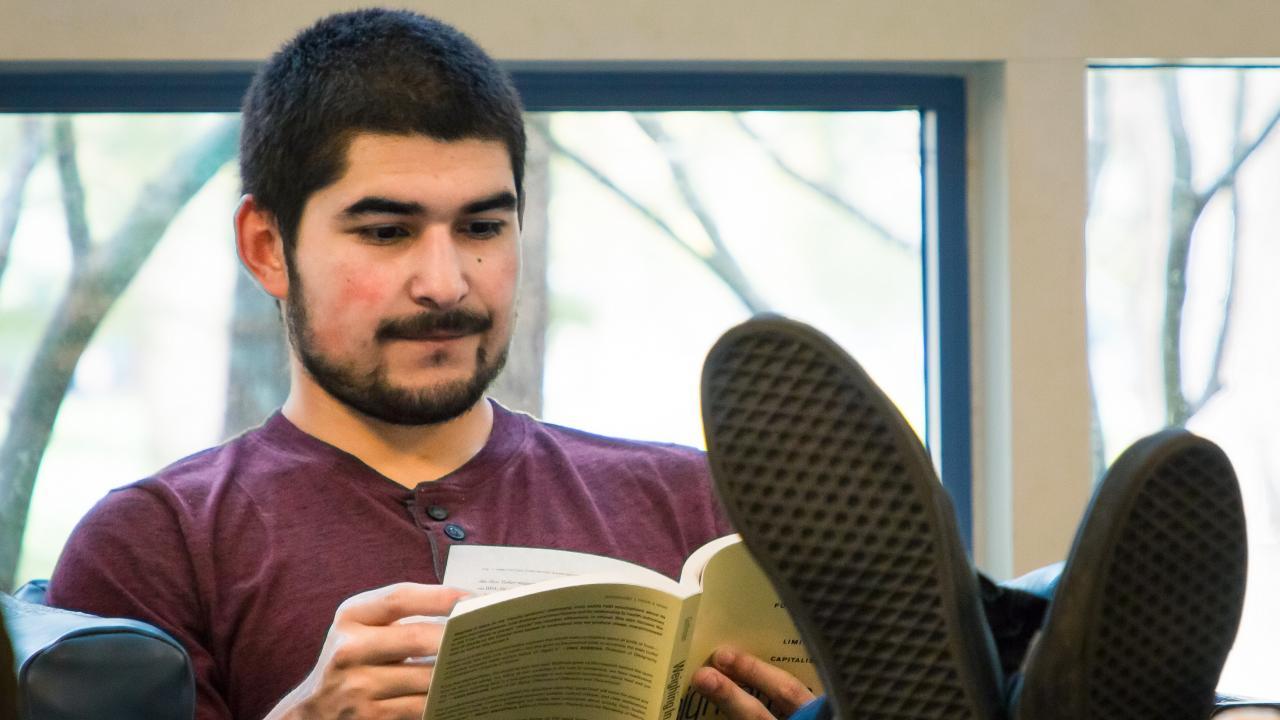 Izaac Ornelas Izaac in his favorite relaxing spot in Shields Library: "After spending a lot of time in the library studying or preparing for exams I will go to that area because the chairs are very relaxing and comfortable. I get to sink into a chair after sinking my mind in school related information. As students we spend a lot of time studying and little time relaxing, so it’s always nice to decompress." Photo Credit: Daniel Oberbauer