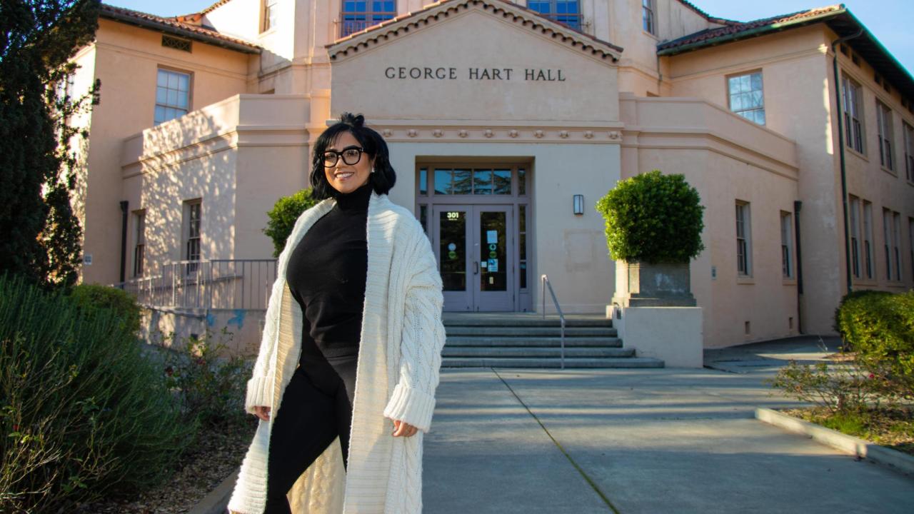 Johni Rose Zamorano in front of Hart Hall