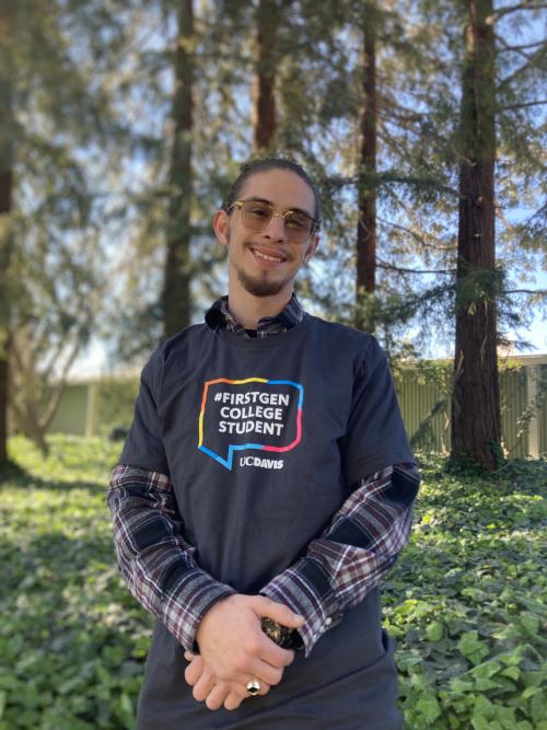 Alfredo Trinidad Lira III smiling with First Gen shirt and sunglasses