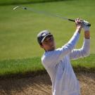 First Generation College Student Ryan Han plays golf. 